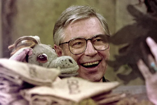 Fred Rogers works with Donkey Hodie, one of the puppets featured on his children's television program, "Mister Rogers' Neighborhood," in Pittsburgh on June 27, 1993. (AP Photo/Gene J. Puskar).